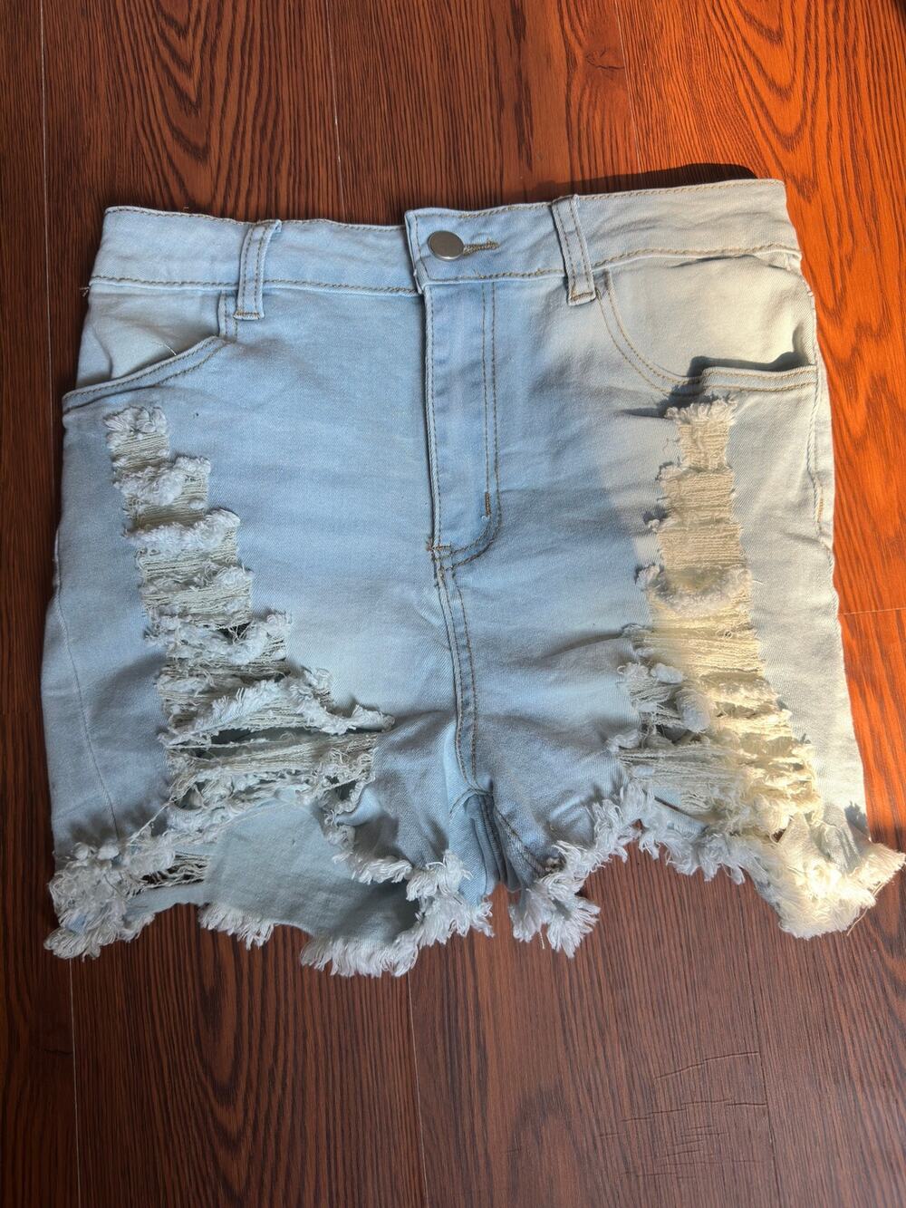Light Blue High-rise distressed denim shorts
